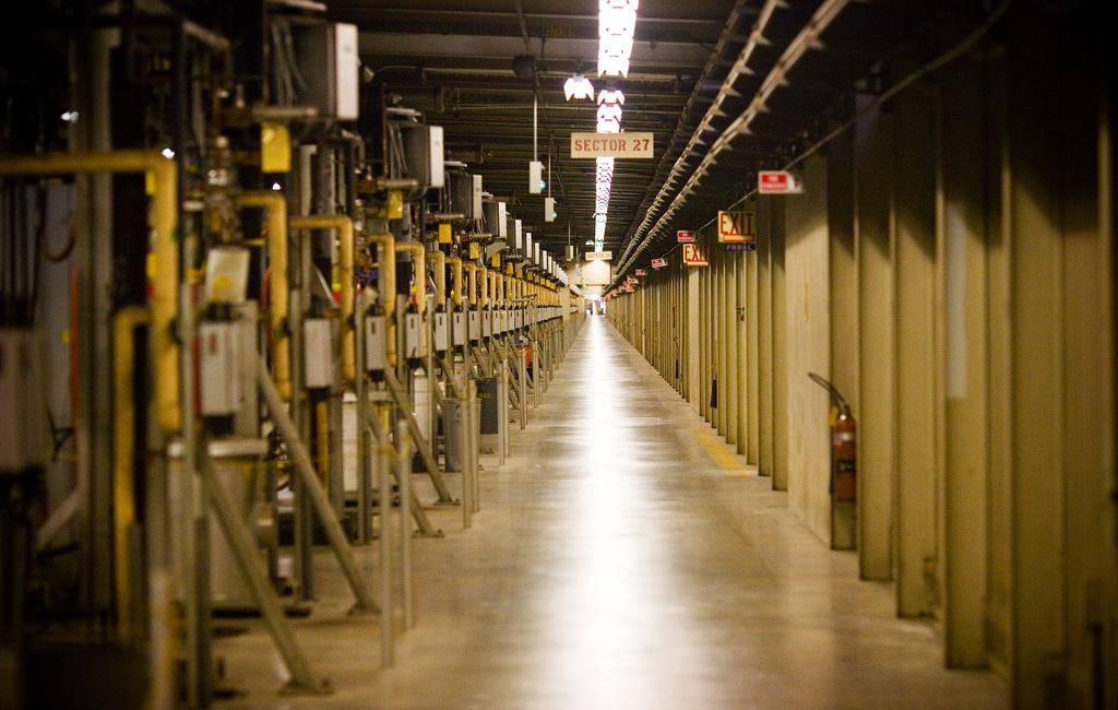 A long corridor with numbered doors.