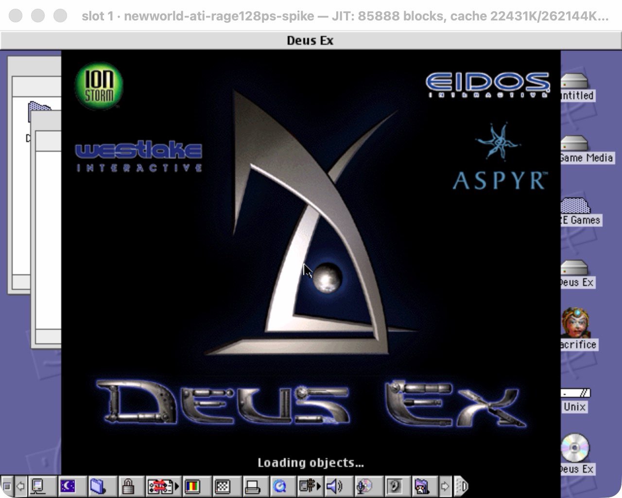 The Deus Ex splash screen with Ion Storm, Eidos, Westlake Interactive and Aspyr logos, reading Loading objects, running in a window on a Mac OS 9 desktop with hard disk icons down the right edge.